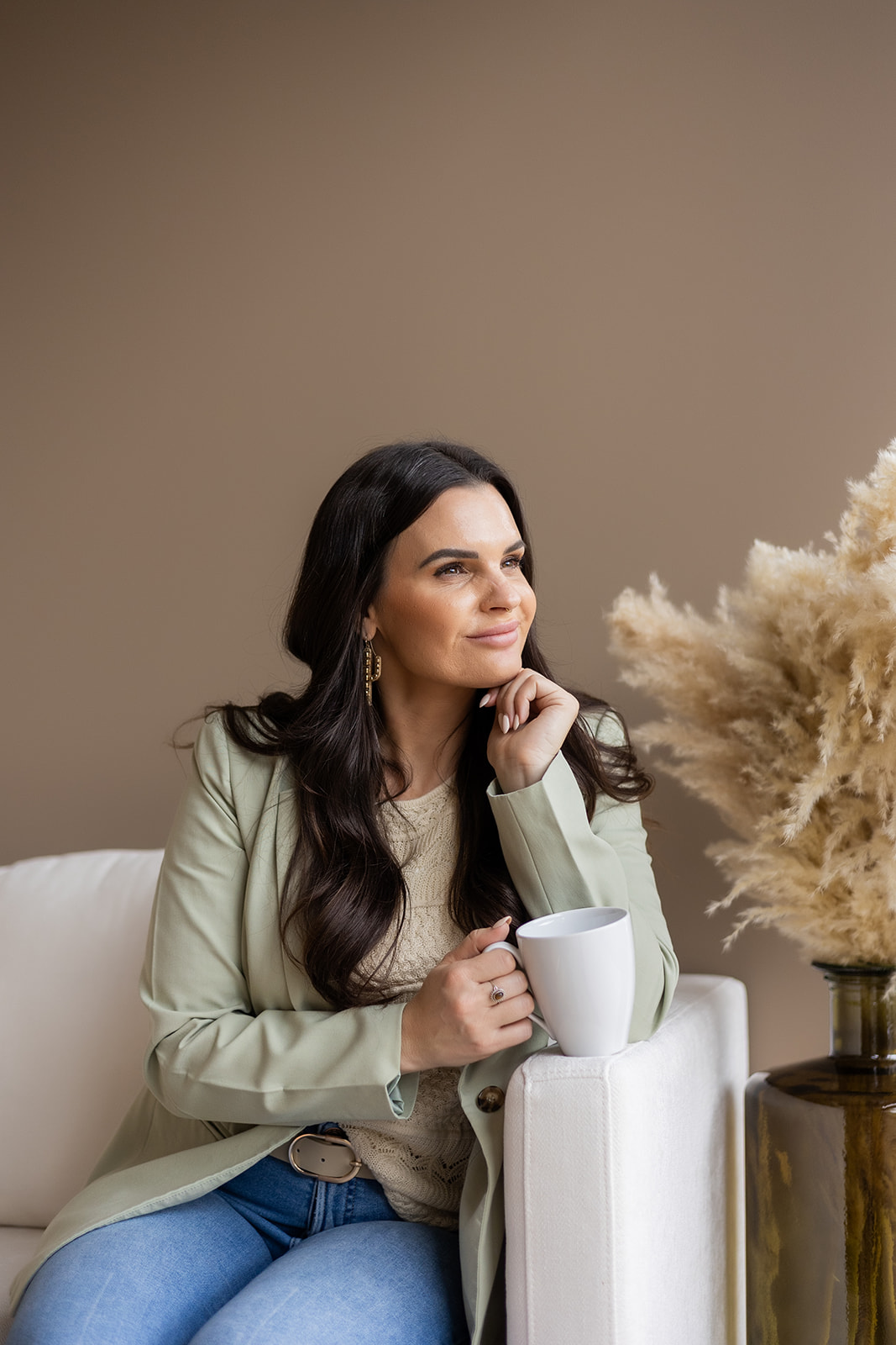 Trauma therapist seated in a calm space, reflecting themes of body shame, modesty culture, purity culture, and religious trauma.
